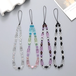 Detail view of four handmade beaded phone lanyards with colorful acrylic crystal beads