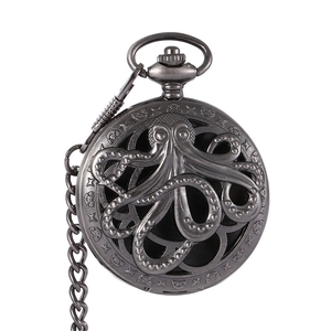 Detailed close-up of vintage hollow octopus and star patterns on a metal pocket watch cover
