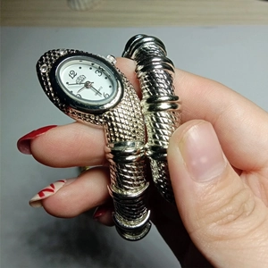 Silver snake wrap watch for women with rhinestone head and quartz dial movement