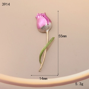 Detail showing tulip brooch dimensions 55mm height and 14mm width with gold alloy finish