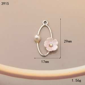 Detailed view of alloy oval pendant with pink flower, pearl, and 29mm size markings