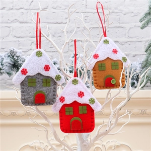 Close-up of felt house ornaments with snowy faux fur roofs for Christmas tree decor