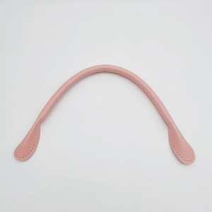 Close-up of pink leather handbag replacement handle with detailed stitching holes