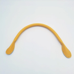 Detail of yellow leather handbag handle with pre-punched stitching holes for DIY repair