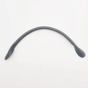 Detailed view of black thickened leather handbag handle with core stitching and texture