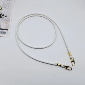 Close-up of a white PU leather round purse strap with golden metal swivel hooks