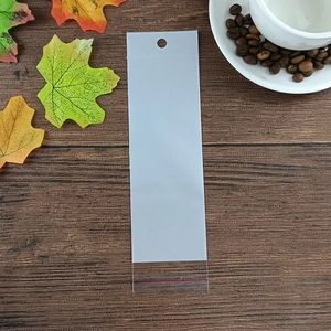 Close-up of a long clear self-sealing poly bag with a red seal and hanging hole detail