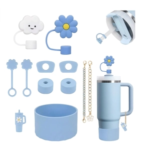 Light blue 40oz insulated tumbler set with floral straw covers and silicone boot