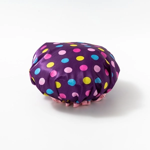 Waterproof purple shower cap with colorful polka dots and pink elastic band for women