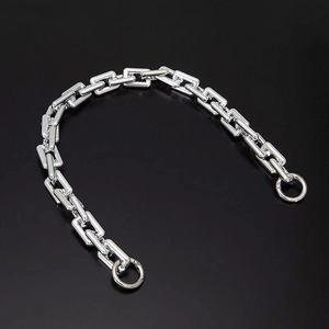 Silver rectangular metal chain strap with circular clasps on a dark background
