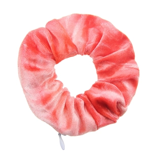 Pink velvet scrunchie featuring a hidden zipper pocket for small item storage