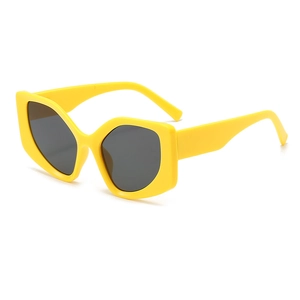 Chic oversized yellow cat-eye sunglasses with bold geometric frame and dark lenses