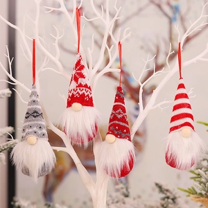 Knitted Christmas gnome hanging ornaments with white beards on decorative branches