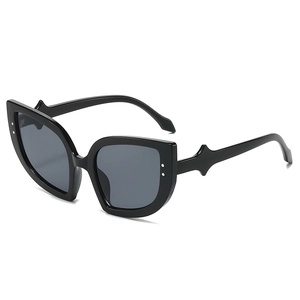 Chic black cat eye sunglasses with silver rivet accents and dark grey lenses for women