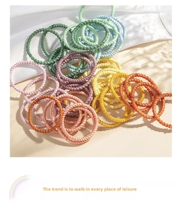 Macro shot of colorful spiral elastic hair bands in macaron shades for kids hair styling