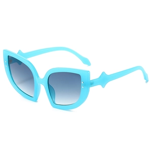 Blue cat eye sunglasses with gradient lenses and silver rivet accents for women
