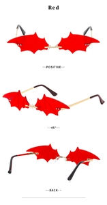 Three-angle view of red bat-wing shaped novelty sunglasses with gold metal temples