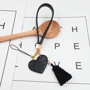Black leather heart keychain with fringe tassel and gold metal hardware for phone wrist strap