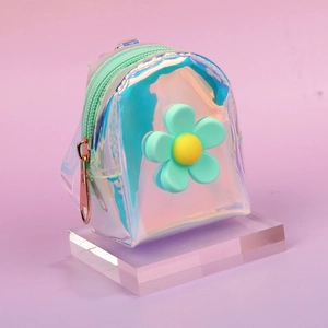 Close-up of laser transparent mini backpack coin purse with a green flower and gold zipper