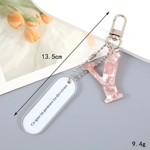 Pink marble acrylic Y-shaped keychain with white tag and dimensions 13.5cm 9.4g