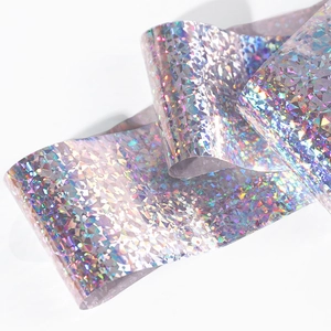 Holographic broken glass nail art foil with iridescent laser effect on white background