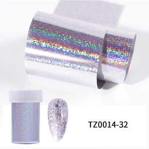 Detailed view of silver holographic nail foil with storage bottle and sample nail art