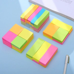 Close-up of assorted mini colorful cartoon sticky notes in vibrant neon colors for students