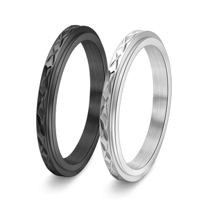 Cross brushed metal spinner rings in black and silver colors with star engraving