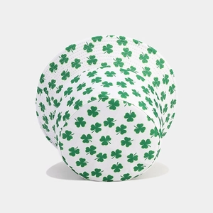 White reversible bucket hat with green clover print shown from a 45-degree angle