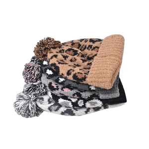 Knit beanie hat with leopard print pattern and fluffy pompom decoration for women
