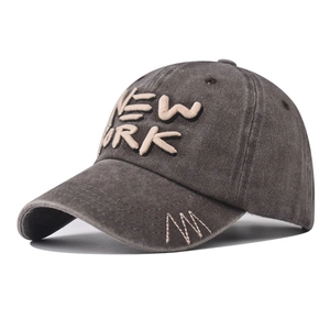 Side view of washed dark gray New York baseball cap with premium 3D embroidery detail