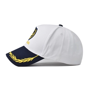 White captain baseball cap with gold anchor embroidery and navy blue brim for maritime style