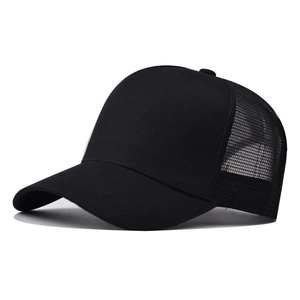 Side view of black mesh trucker hat with solid cotton front panel and curved brim