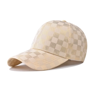 Detailed side view of champagne and gold checkered satin baseball cap with fine stitching
