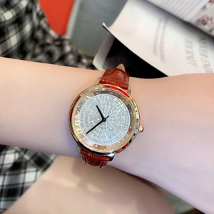 Elegant rose gold women's watch with diamond-encrusted dial and red leather strap