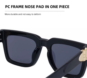 Detail of square sunglasses showing integrated nose pads and durable metal hinges