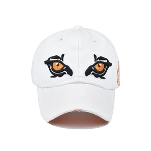 Close-up of high-density three-color embroidered eye pattern on a white baseball cap