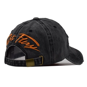 Detailed back view of distressed black baseball cap with orange Light Fury embroidery