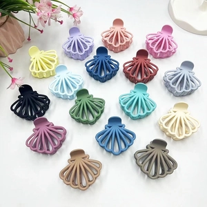 Elegant hollow shell shaped hair claws set in various colors with a matte plastic finish