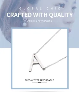 Macro detail of silver capital letter A pendant on a thin chain necklace for women