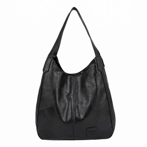 Classic black litchi pattern leather tote bag with geometric stitching for daily use
