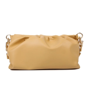 Detailed view of yellow leather cloud bag featuring pleated design and gold chain strap