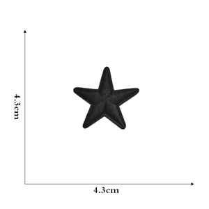 Close-up of a black star embroidery patch with litchi texture measuring 4.3cm by 4.3cm