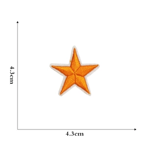 Macro view showing 4.3cm orange star embroidery patch with precise dimensions