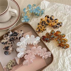 Collection of chic acetate flower hair claws in five mixed tortoise shell patterns