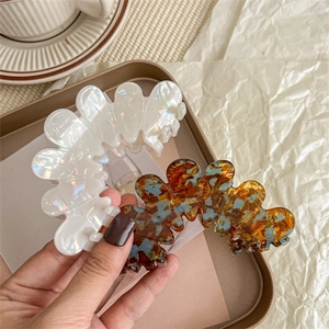 Chic acetate hair claw clips in shell white and tortoiseshell wave design for women