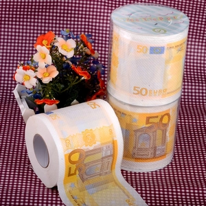 Detail view of 50 Euro novelty printed toilet paper roll on red checkered fabric