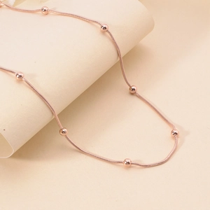 Elegant rose gold stainless steel snake chain necklace with seven small polished beads