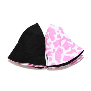Pink and white cow print bucket hat with a classic solid black sun hat option