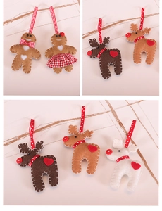Detailed view of handcrafted felt gingerbread man and reindeer Christmas tree ornaments